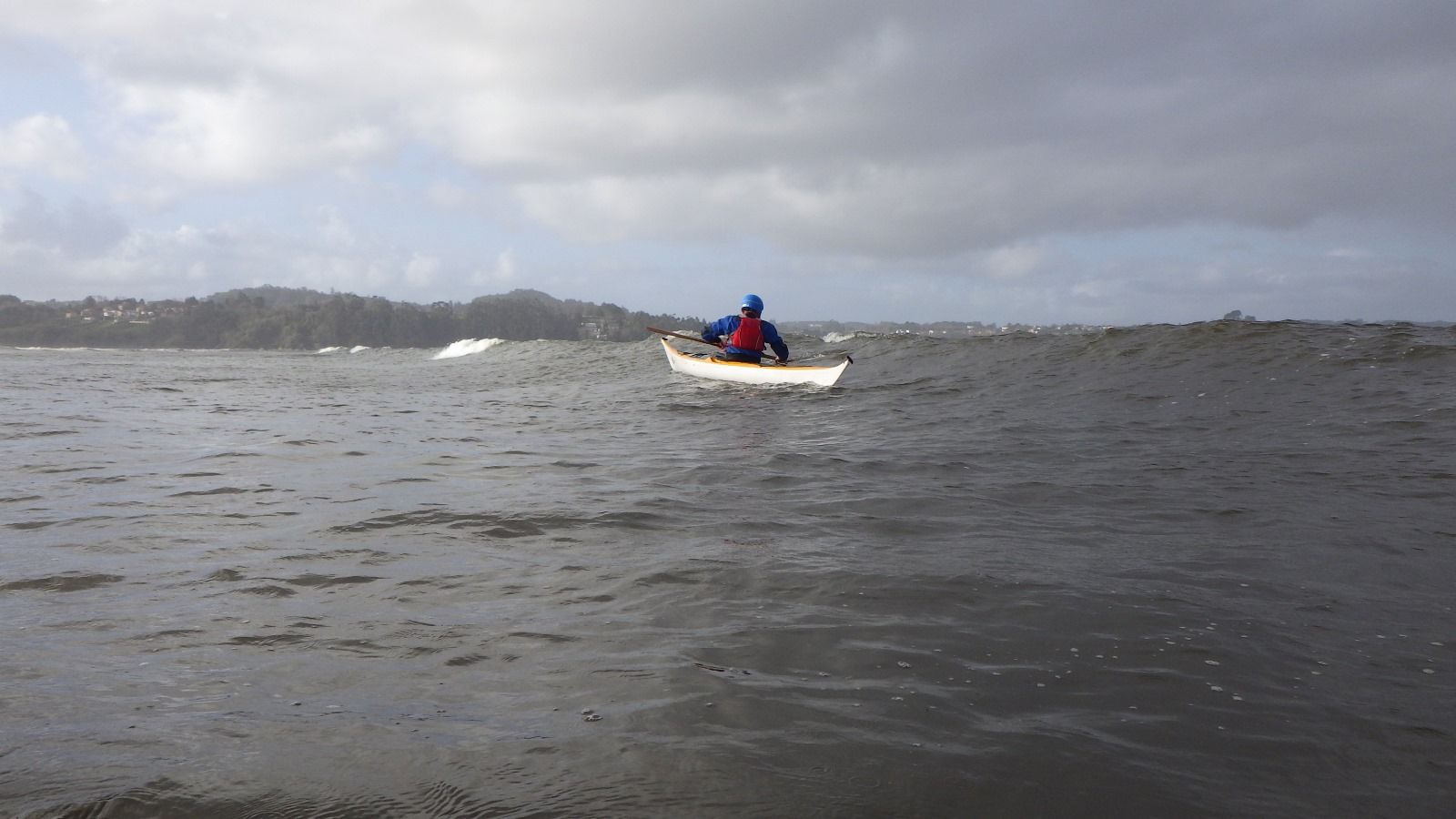 Practicing low recoveries in kayak surf